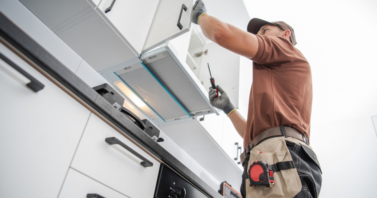 Skilled trades coordinating a kitchen renovation including cabinetry, electrical, tile, and finish work