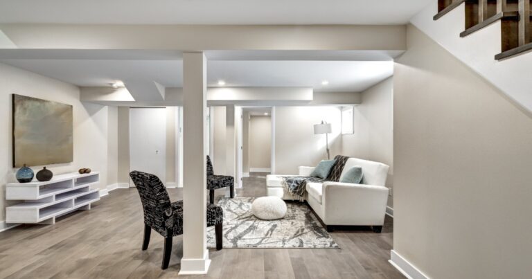 Finished basement renovation with open living area, recessed lighting, durable flooring, and clean trim details