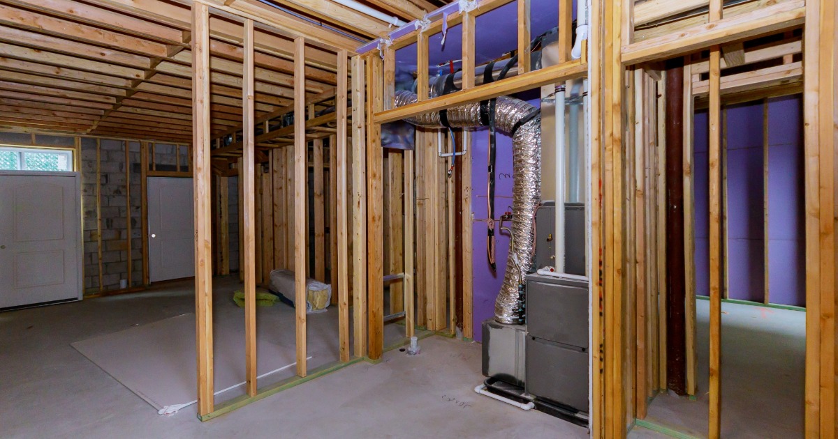 Basement renovation detail showing insulation, wall framing, and durable construction planning for below-grade spaces